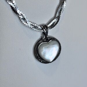 Beautiful double sided pendant, MOP/ Sterling Silver.  Elegant design